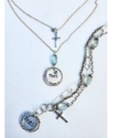 silver chain faith necklace and multi chain bracelet on pale blue background