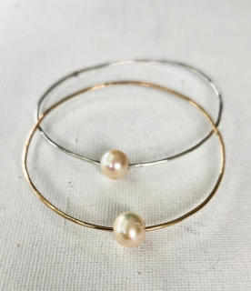 Pretty silver and gold bangle braclets with large white freshwater pearls