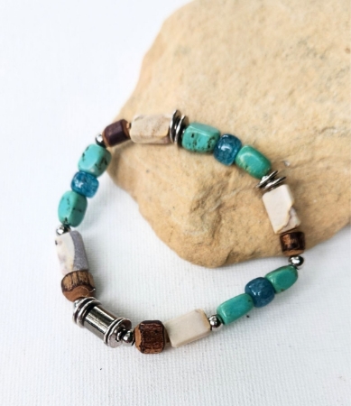 unisex ocean themed gemstone stretch bracelet on rock