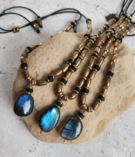 3 labradorite brass bead necklace on a rock