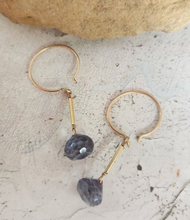 gold mini hoop lavender topaz earrings on rock