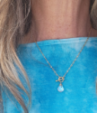 rainbow quartz-gold chain necklace on wood