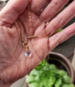 rainbow quartz stone held in hand