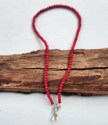full view rainbow quartz necklace with deep pink beads on wood
