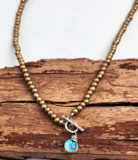 close up matte gold beaded rainbow quartz pendant necklace