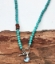 close up turquoise sunstone rainbow quartz toggle necklace on wood