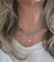  turquoise sunstone rainbow quartz toggle necklace on model with wwhite top