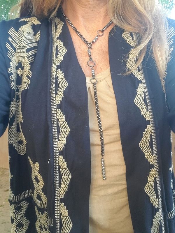 wearing long back chain silver bead Y necklace