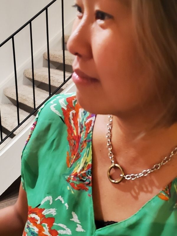 wearing chunky silver chain gold circle necklace