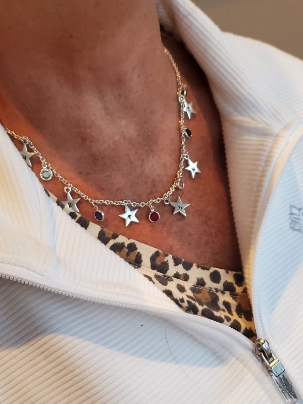silver star Swarovski crystal necklace on neck