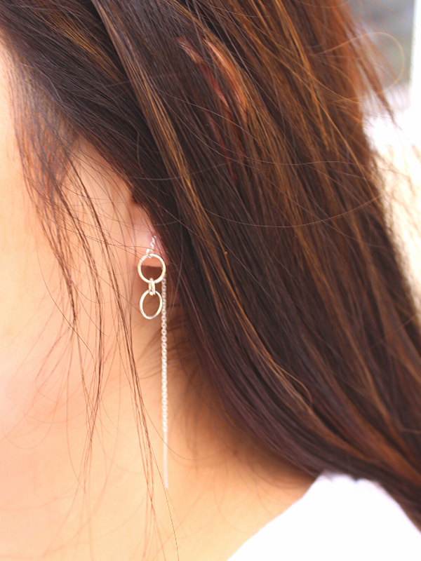 silver ear threads worn on female