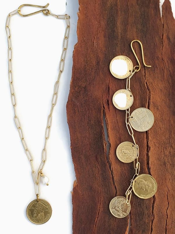coin jewelry gold chain on wood