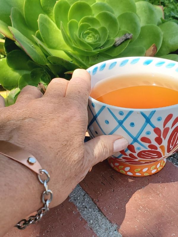 wearing ID bracelet with tea & plants