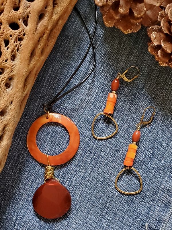 orange & red jewelry on denim fabric