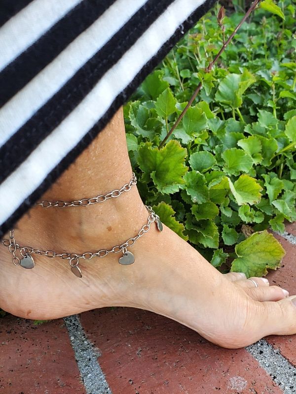 2 anklets on foot with long dress
