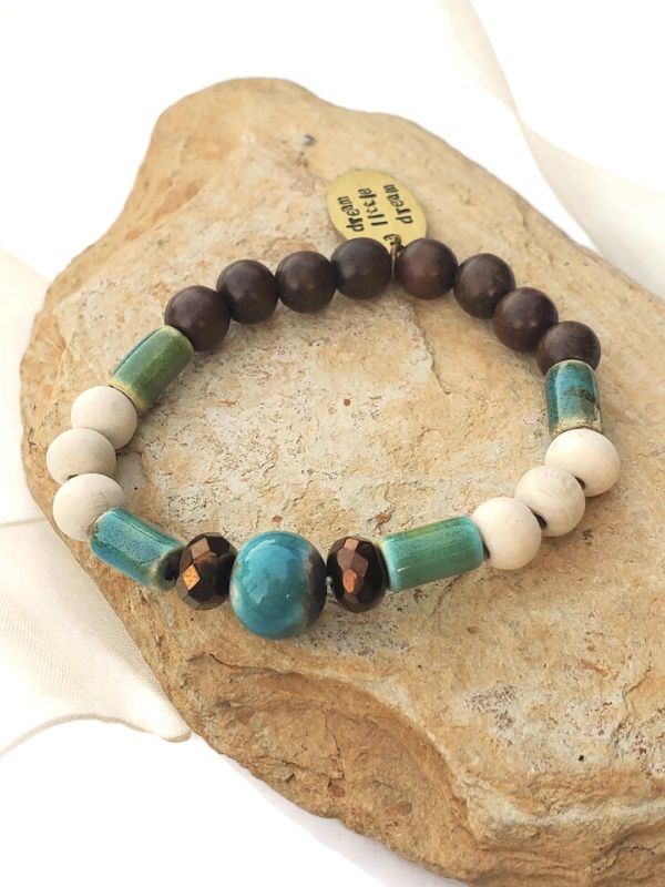 blue green aromatherapy bracelet on stone