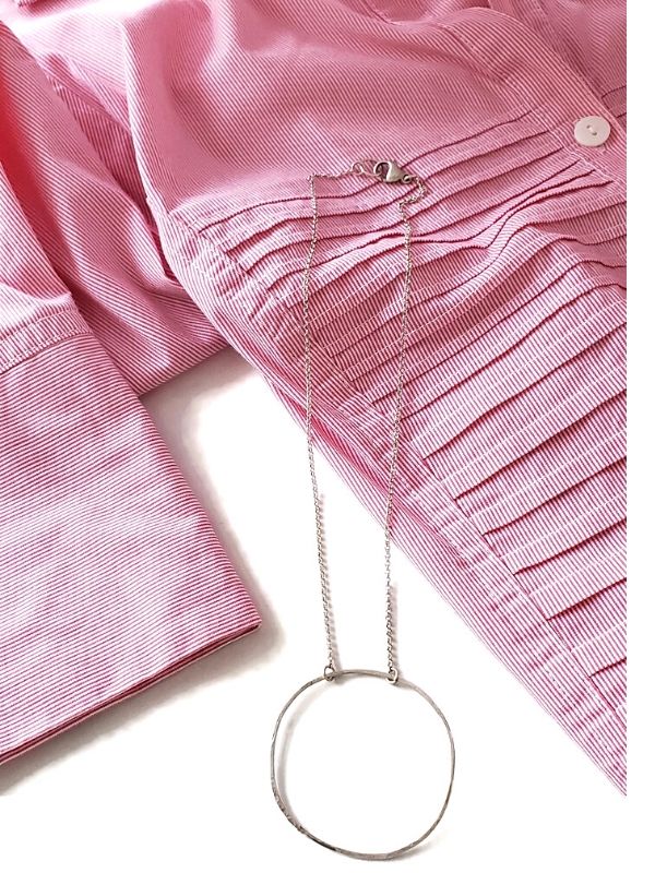 pink summer top with silver circle necklace