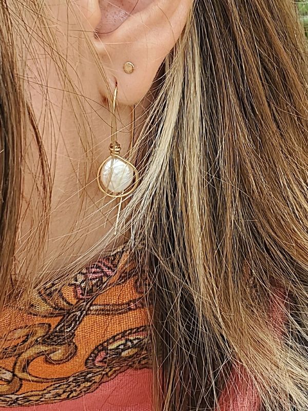 wearing unique pearl earrings