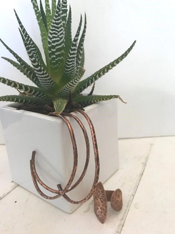 green plant with copper jewelry