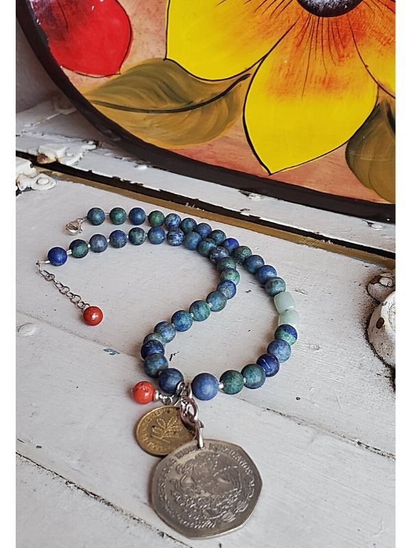 blue red gemstone coin necklace with colorful painted bowl