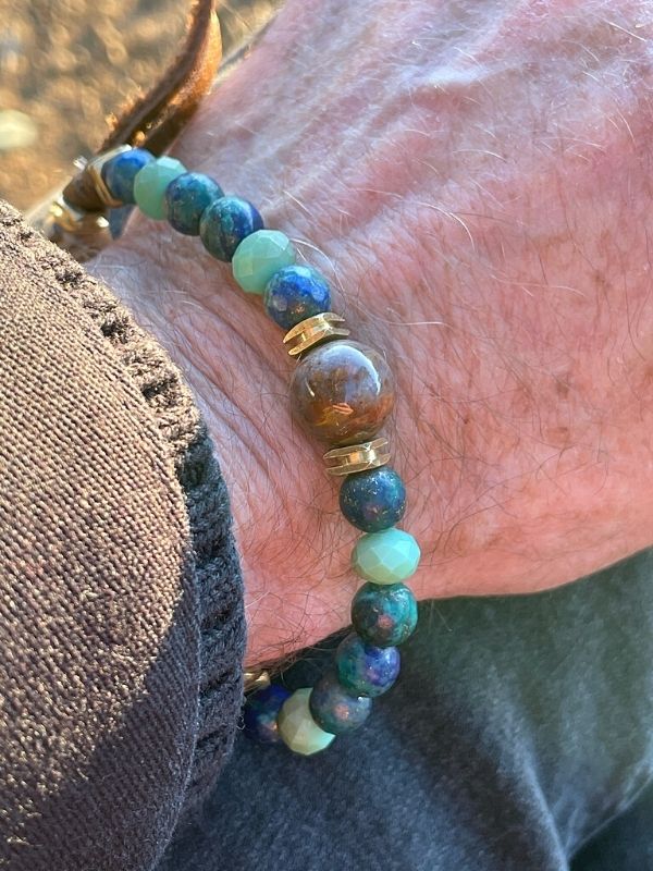 wearing men's gemstone bracelet on wrist with coat