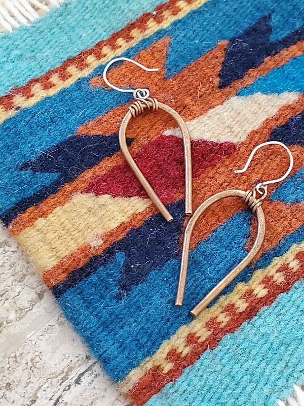 horseshoe earrings on a Southwestern blanket