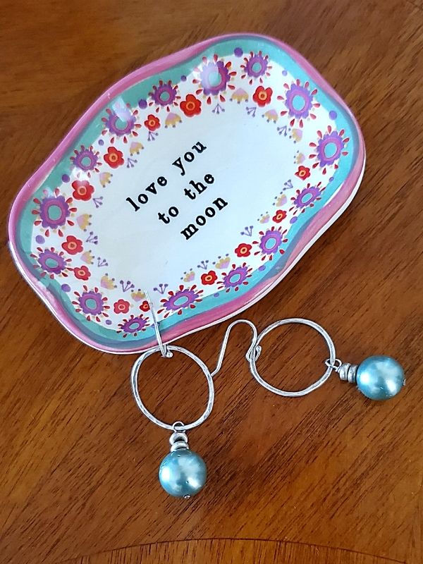 pearl earrings with flowered dish