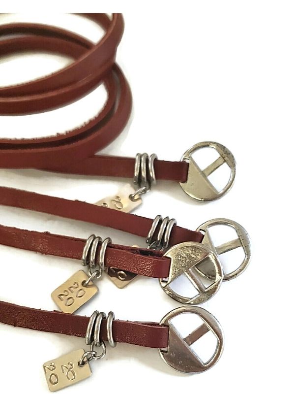 pile of red brown leather wrap bracelets