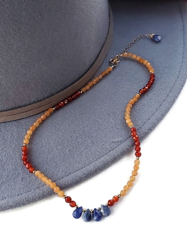 orange red blue gemstone necklace with wood hat