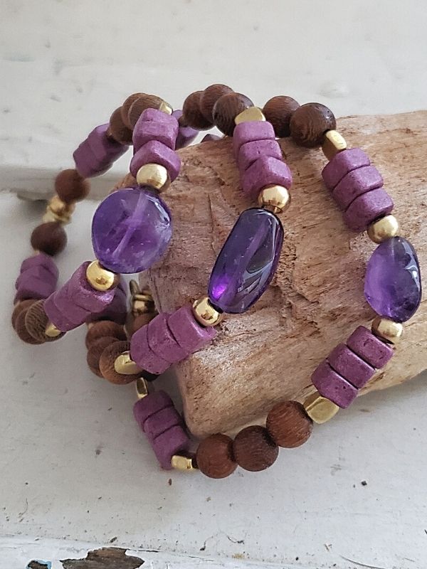 earthy purple gemstone bracelets on wood