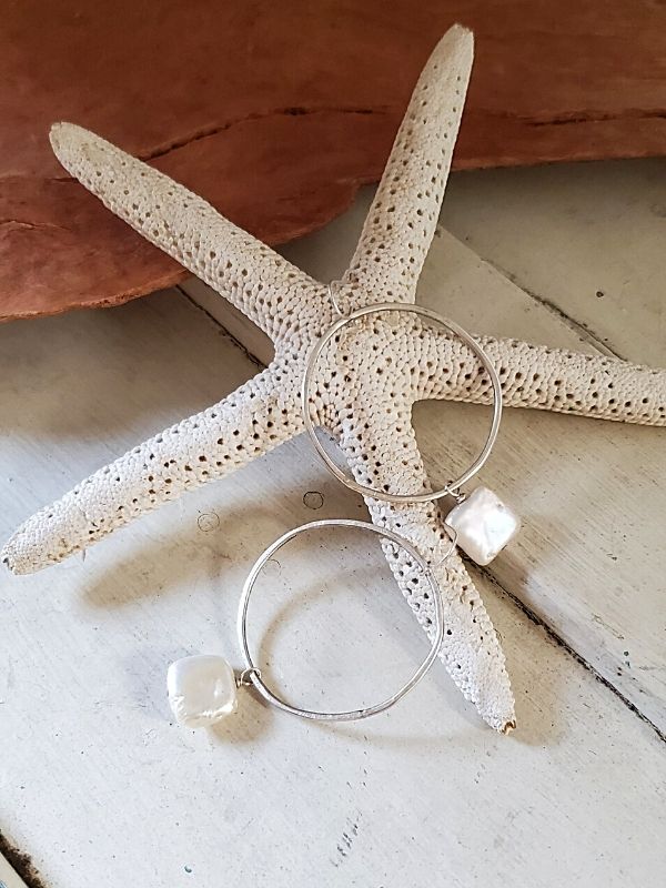pearl hoop earrings on starfish