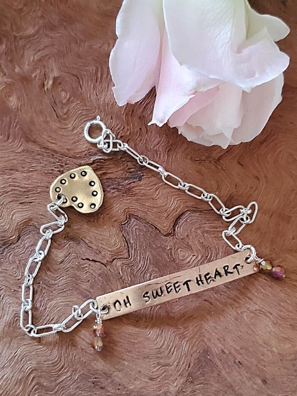 sweetheart Id bracelet with rose on wood