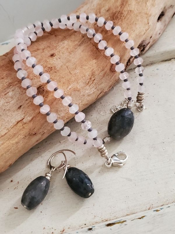 pink gray gemstone necklace earring on branch