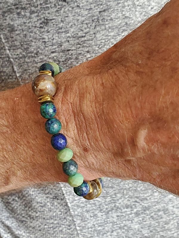 male wearing a blue gemstone bracelet on wrist