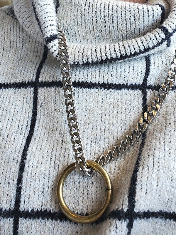 heavy silver chain gold ring necklace with thick sweater