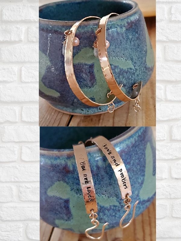 stamped message cuff bracelets on ceramic bowl