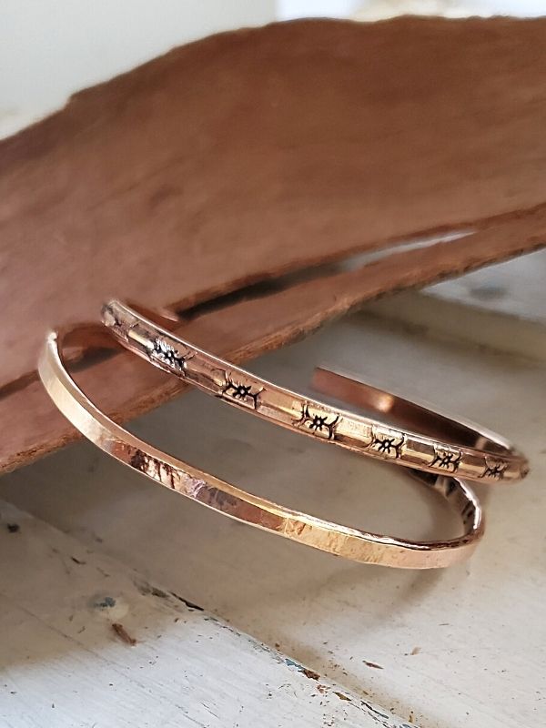 2 bronze cuffs with wood 