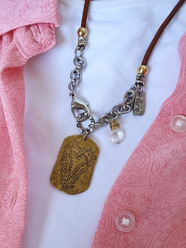 earthy heart necklace on feminine top