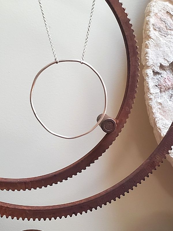 silver circle necklace with rustic ridged circles