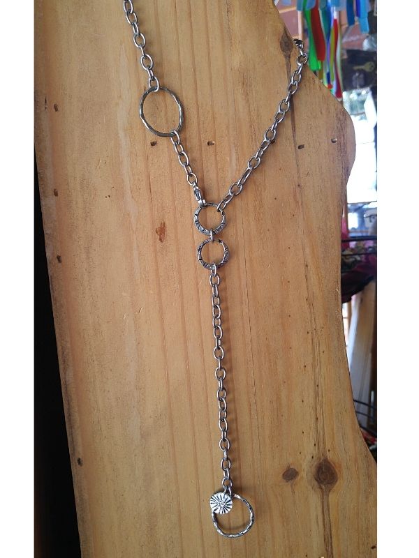 long chain link necklace on board