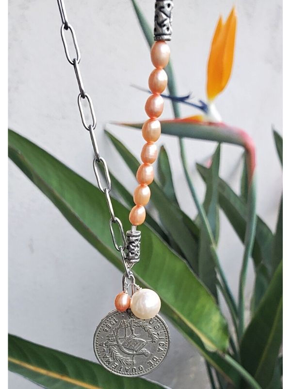 old coin pearl necklace in garden
