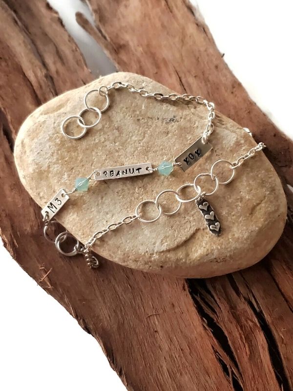 silver mixed chain wrap bracelet on rock