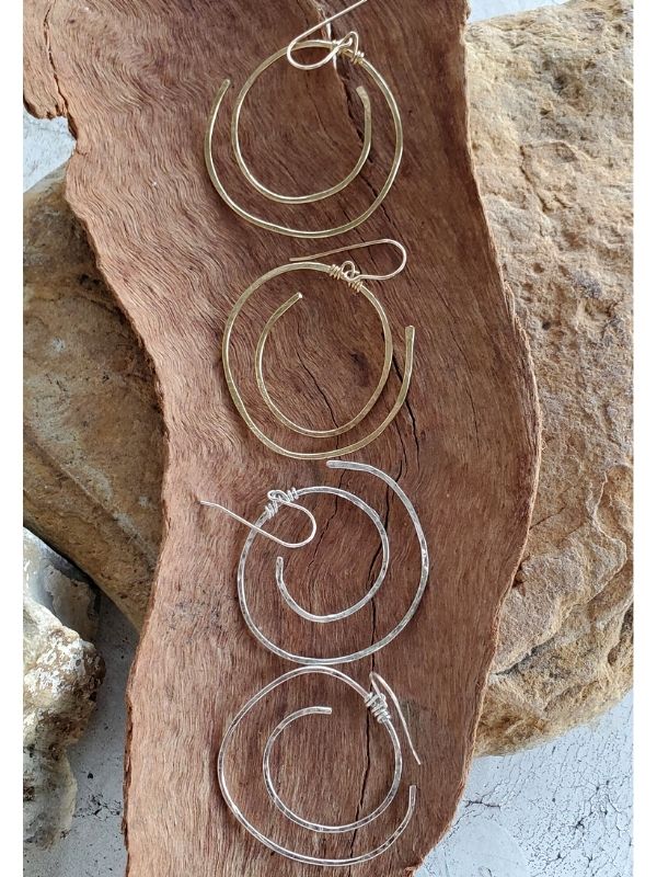 silver & gold spiral hoops on wood