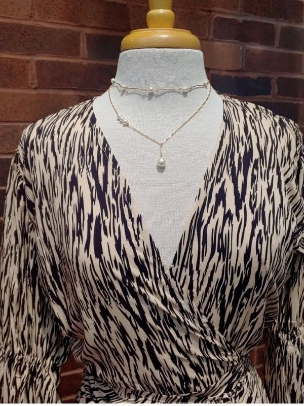 pearl necklaces on mannequin with animal print