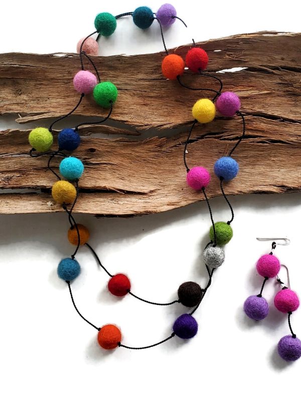 Multi color pom-pom necklace & earrings on wood