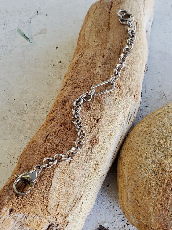 silver rolo chain bracelet on wood