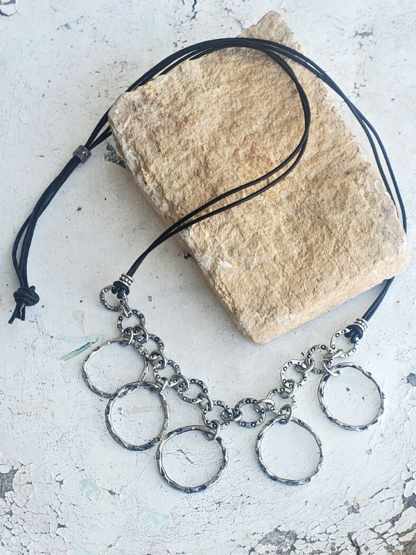 silver ringed bib necklace displayed