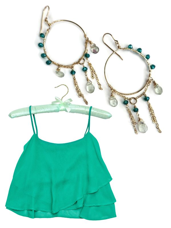 green top on hanger with gold green stone chandelier earrings