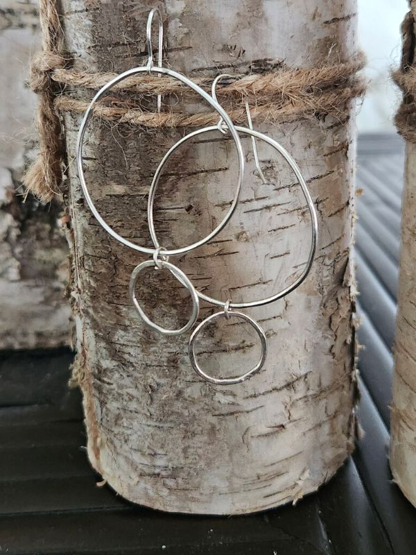 handcrafted silver double hoop earrings on textured post