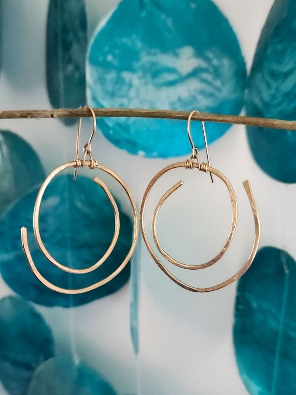 gold spiral earrings and turquoise chimes